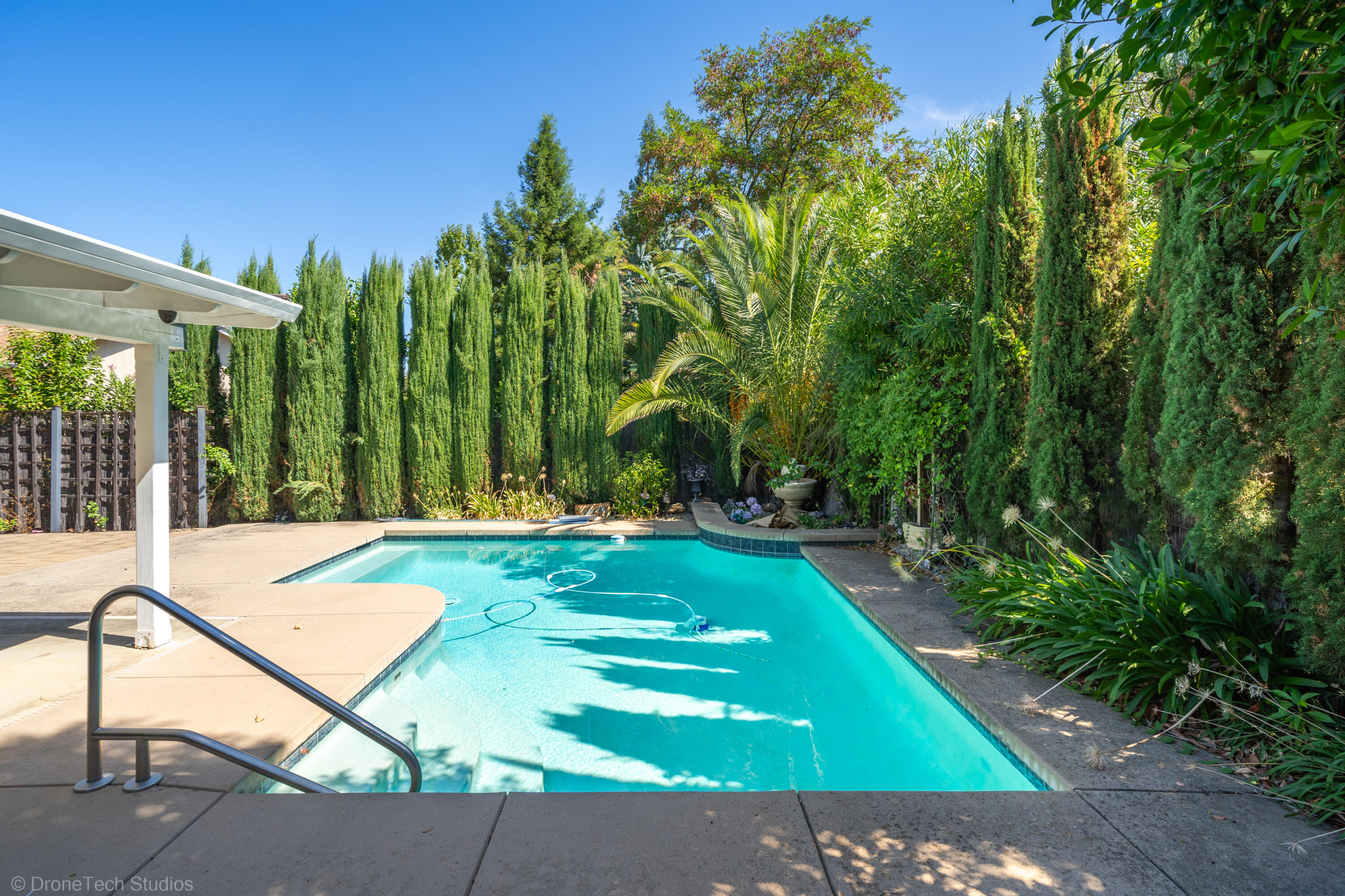 2227 Wicklow Street Redding, CA 96001 - Photo 41 of 90 a view of a backyard with swimming pool