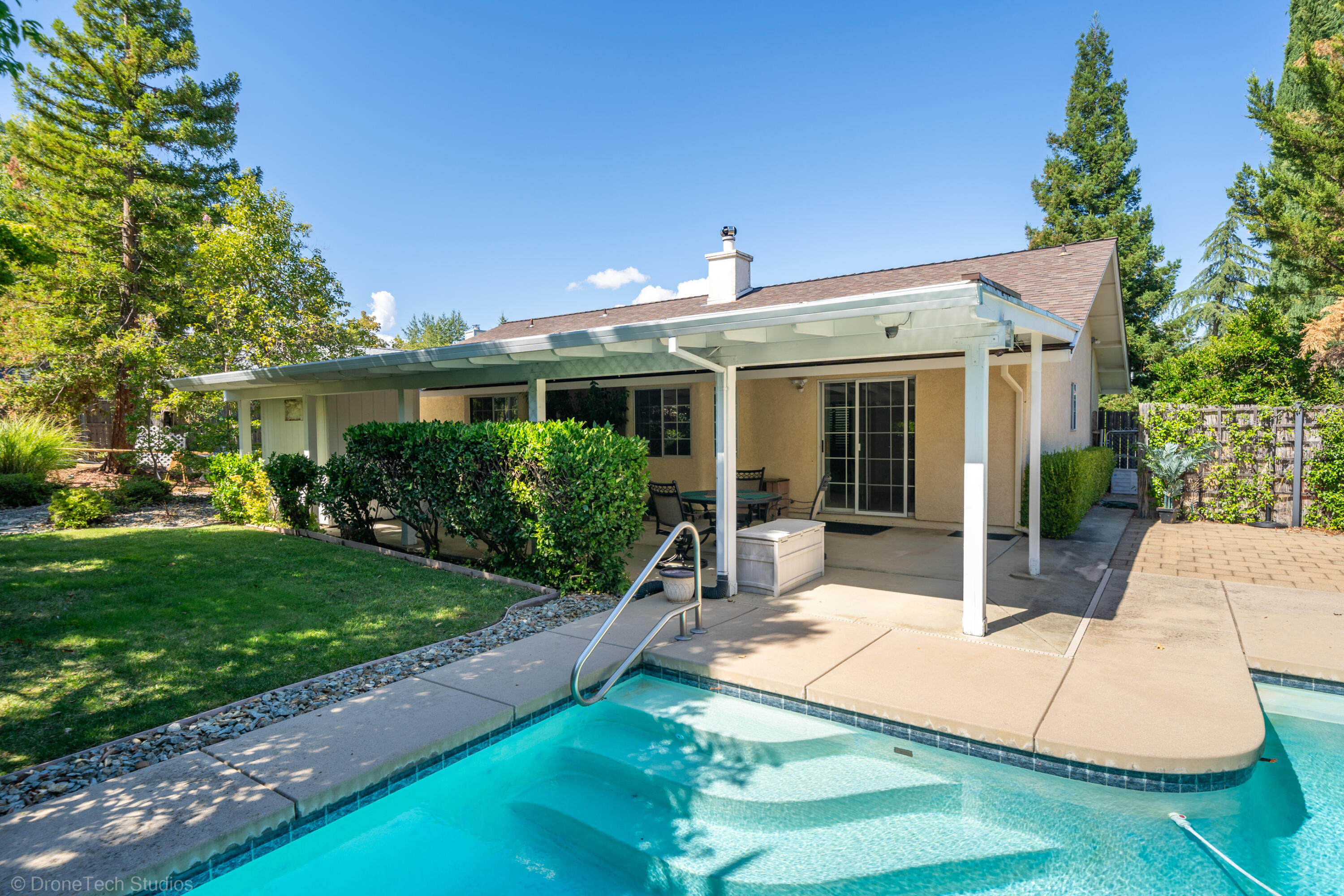 2227 Wicklow Street Redding, CA 96001 - Photo 45 of 90 a view of a house with backyard sitting area and garden