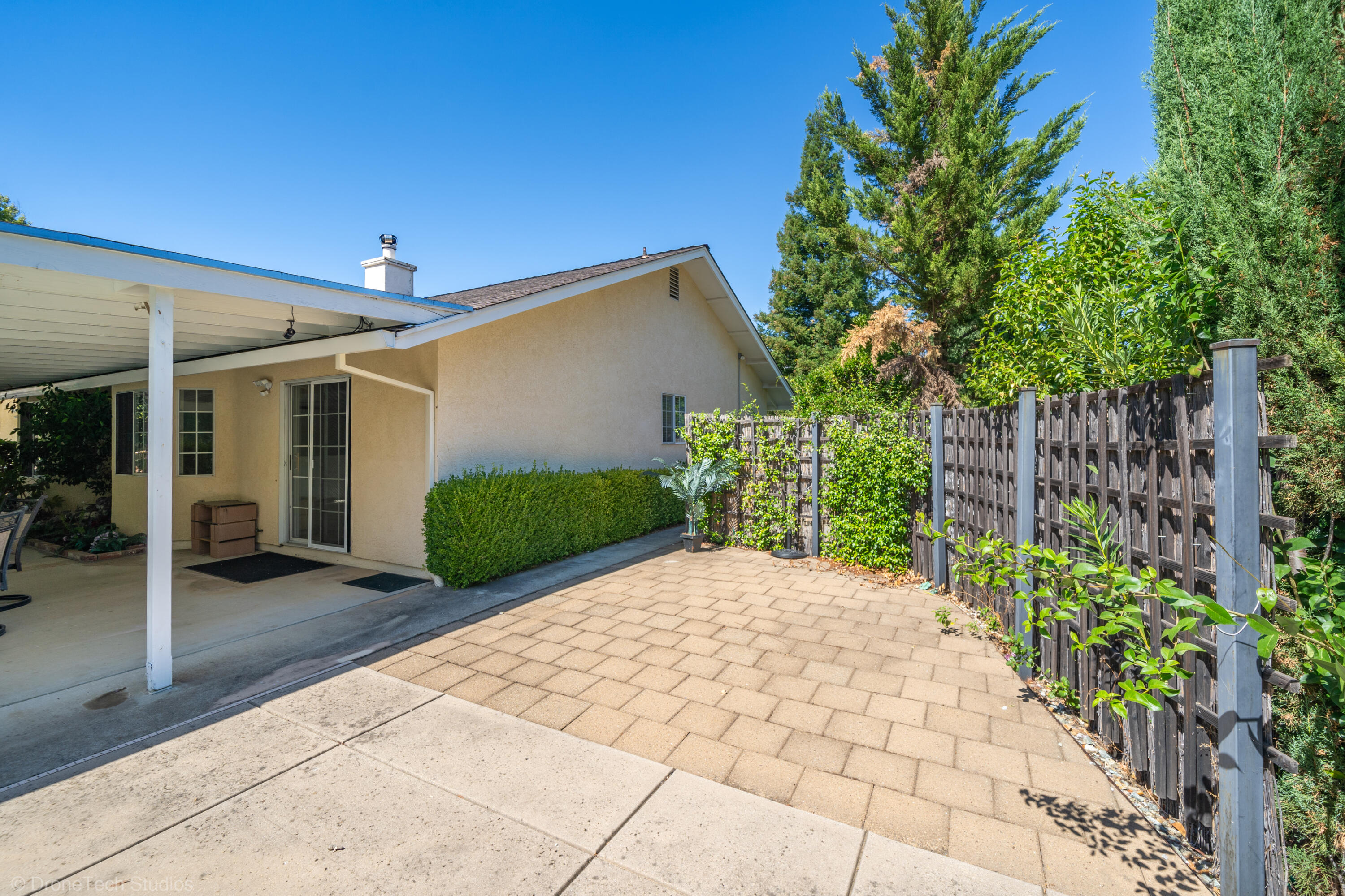 2227 Wicklow Street Redding, CA 96001 - Photo 49 of 90 a view of a chair and tables in the patio