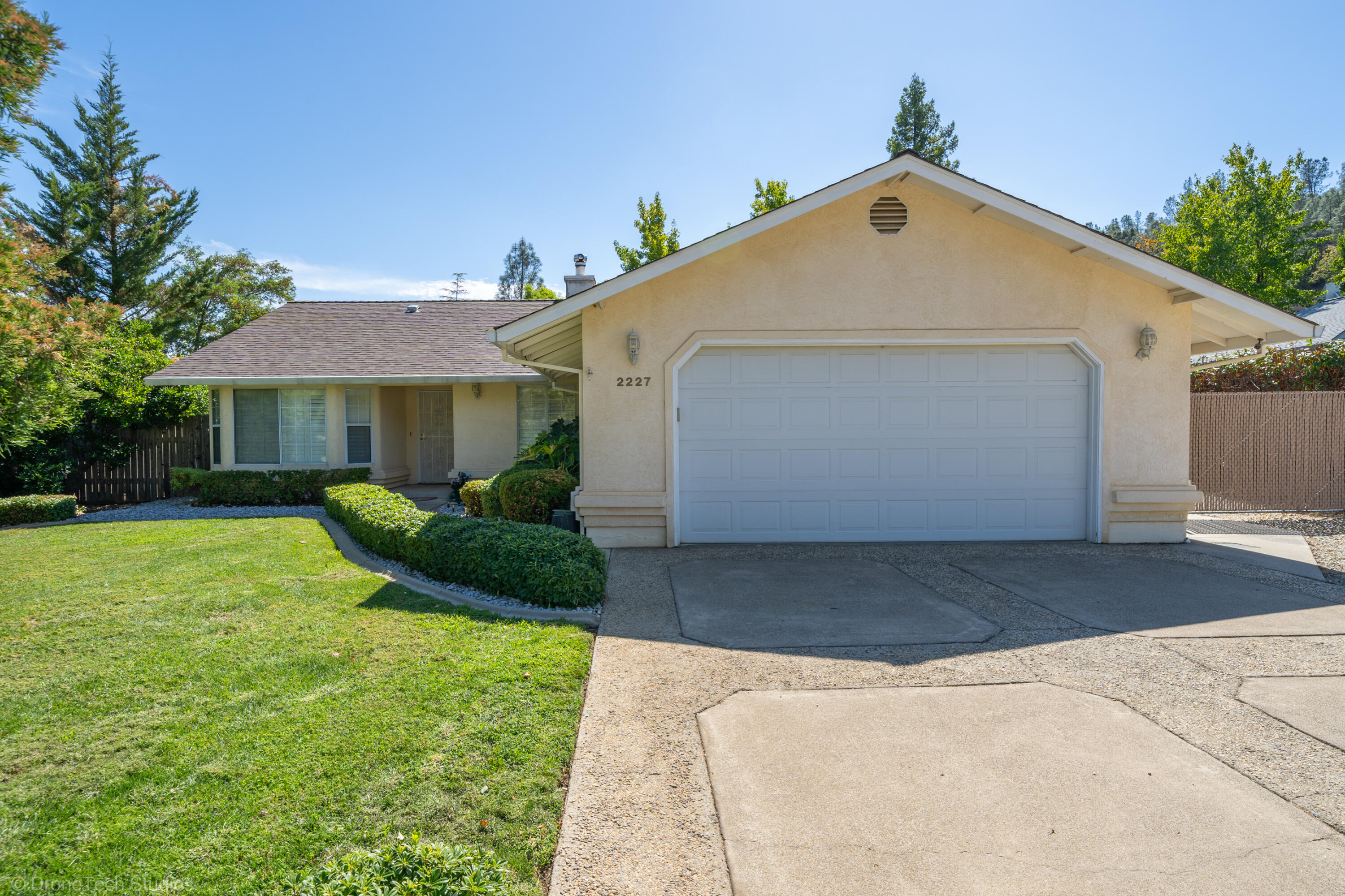 2227 Wicklow Street Redding, CA 96001 - Photo 5 of 90 a front view of a house with a yard