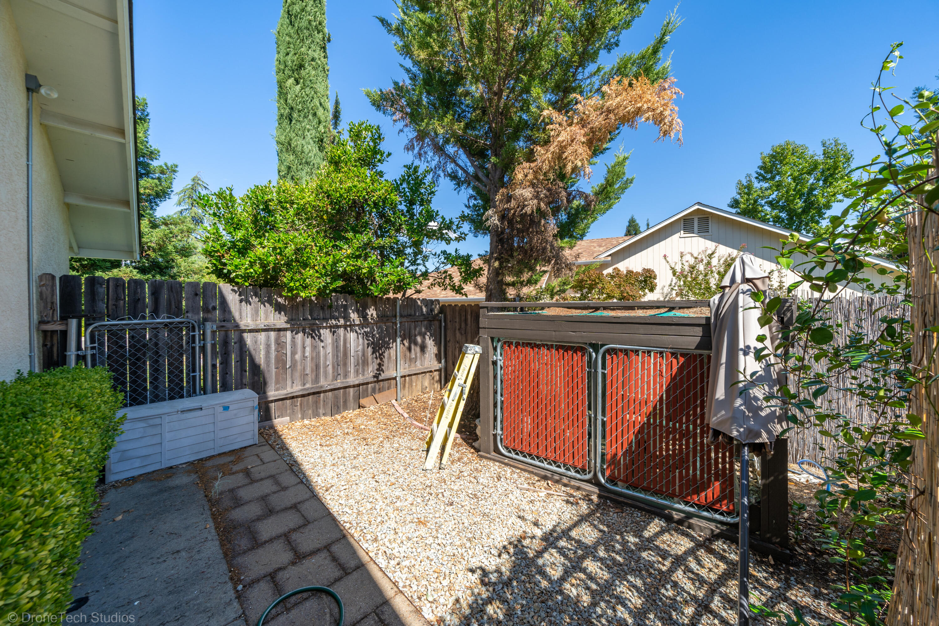 2227 Wicklow Street Redding, CA 96001 - Photo 51 of 90 a view of backyard with a deck and wooden fence