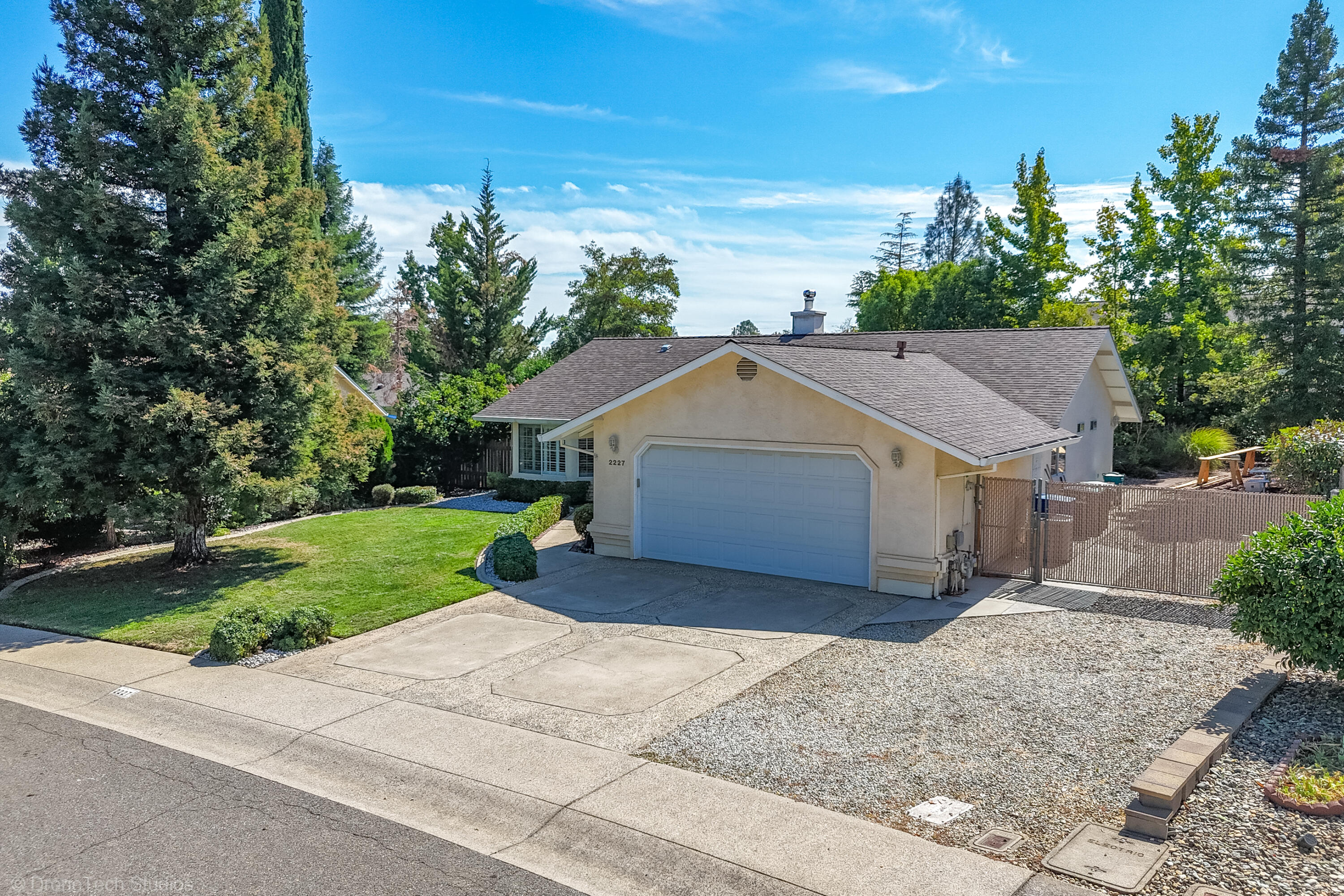2227 Wicklow Street Redding, CA 96001 - Photo 71 of 90 a view of a house with a yard and large tree