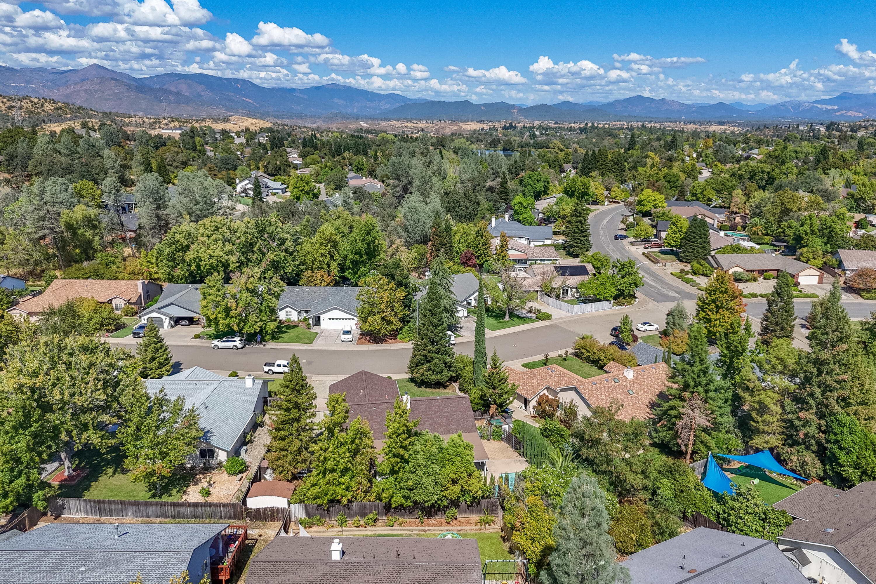 2227 Wicklow Street Redding, CA 96001 - Photo 82 of 90 an aerial view of a city with lots of residential buildings ocean and mountain view in back