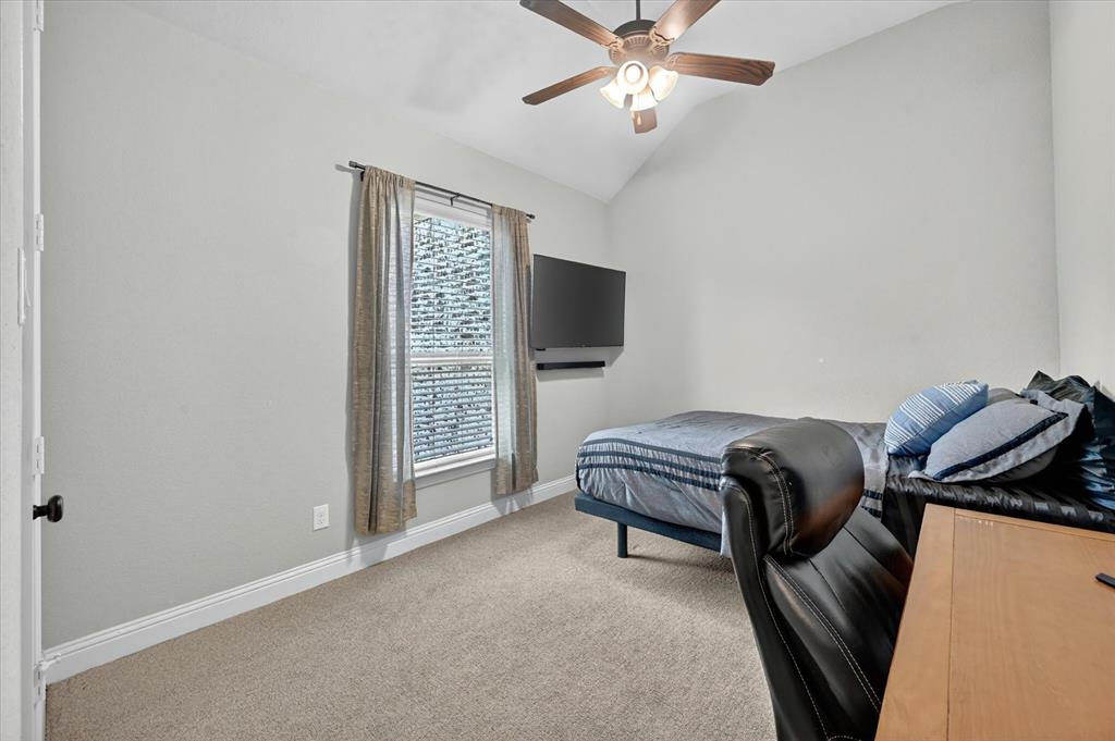 6656 Roughleaf Ridge Road Flower Mound, TX 76226 - Photo 24 of 40 a living room with furniture and a flat screen tv