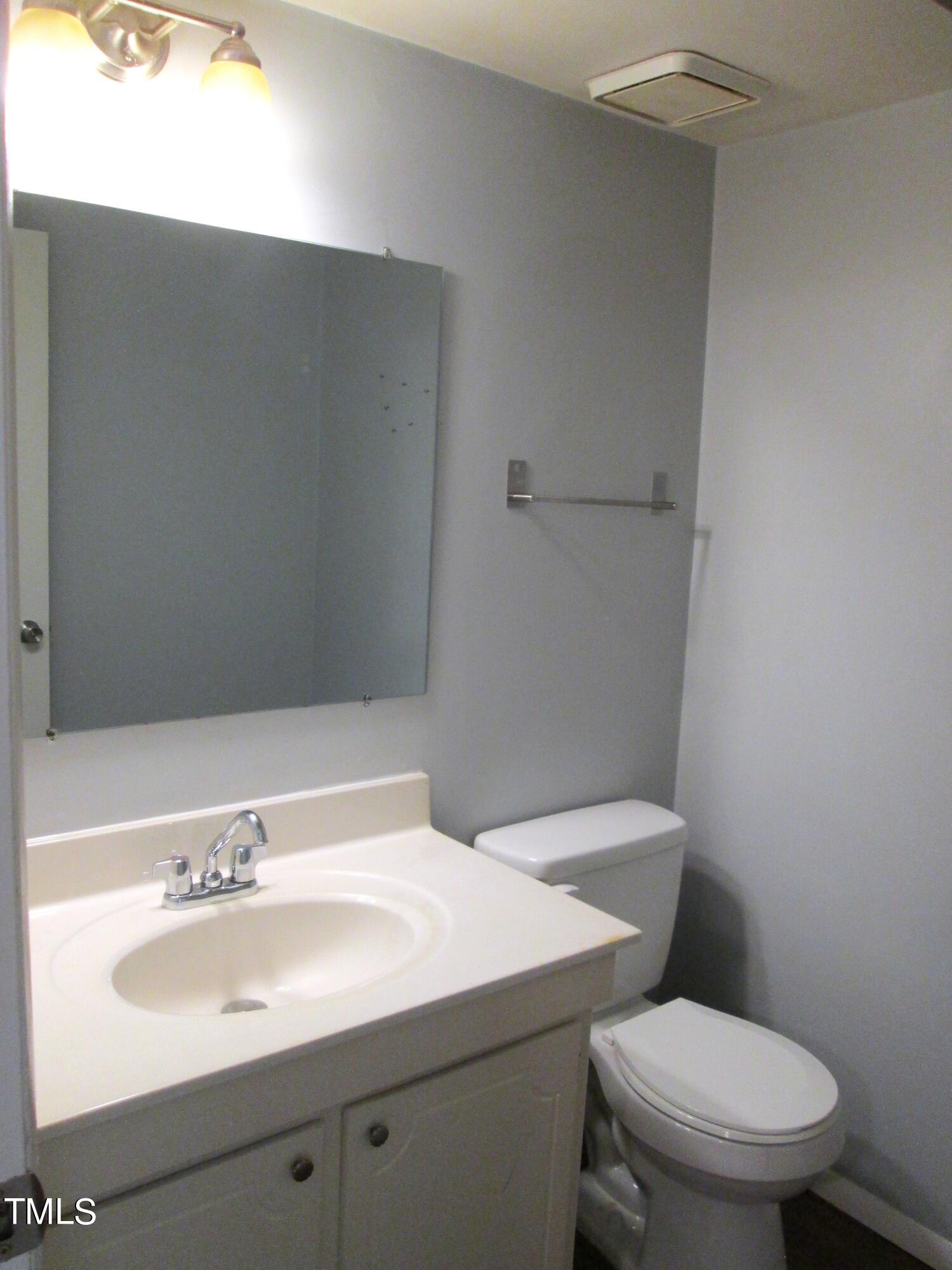 1130 Schaub Drive, Unit E Raleigh, NC 27606 - Photo 18 of 34 Primary half bath