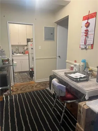a bedroom with a bed and the view of en suite bathroom