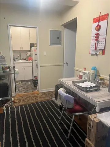 a bedroom with a bed and the view of en suite bathroom