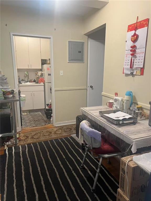 9902 3rd Avenue, Unit 6I Brooklyn, NY 11209 - Photo 5 of 7 a bedroom with a bed and the view of en suite bathroom