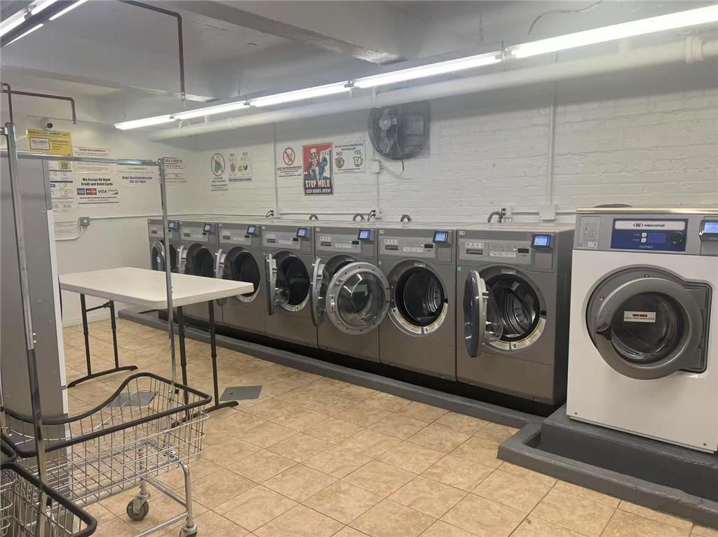 9902 3rd Avenue, Unit 6I Brooklyn, NY 11209 - Photo 6 of 7 a utility room with dryer and washer