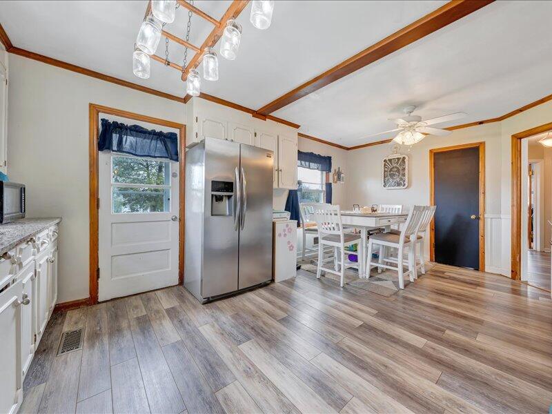 2015 Laura Road Northwest Roanoke, VA 24017 - Photo 13 of 32 a living room with stainless steel appliances kitchen island granite countertop furniture and a wooden floor