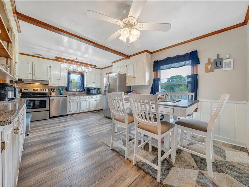2015 Laura Road Northwest Roanoke, VA 24017 - Photo 15 of 32 a view of a kitchen with furniture and wooden floor