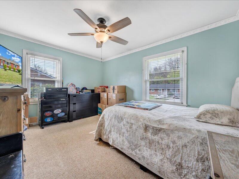 2015 Laura Road Northwest Roanoke, VA 24017 - Photo 18 of 32 a bedroom with a bed dresser and a window