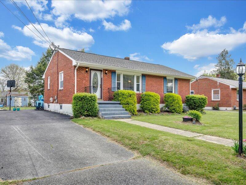 2015 Laura Road Northwest Roanoke, VA 24017 - Photo 27 of 32 a front view of a house with a yard and garage