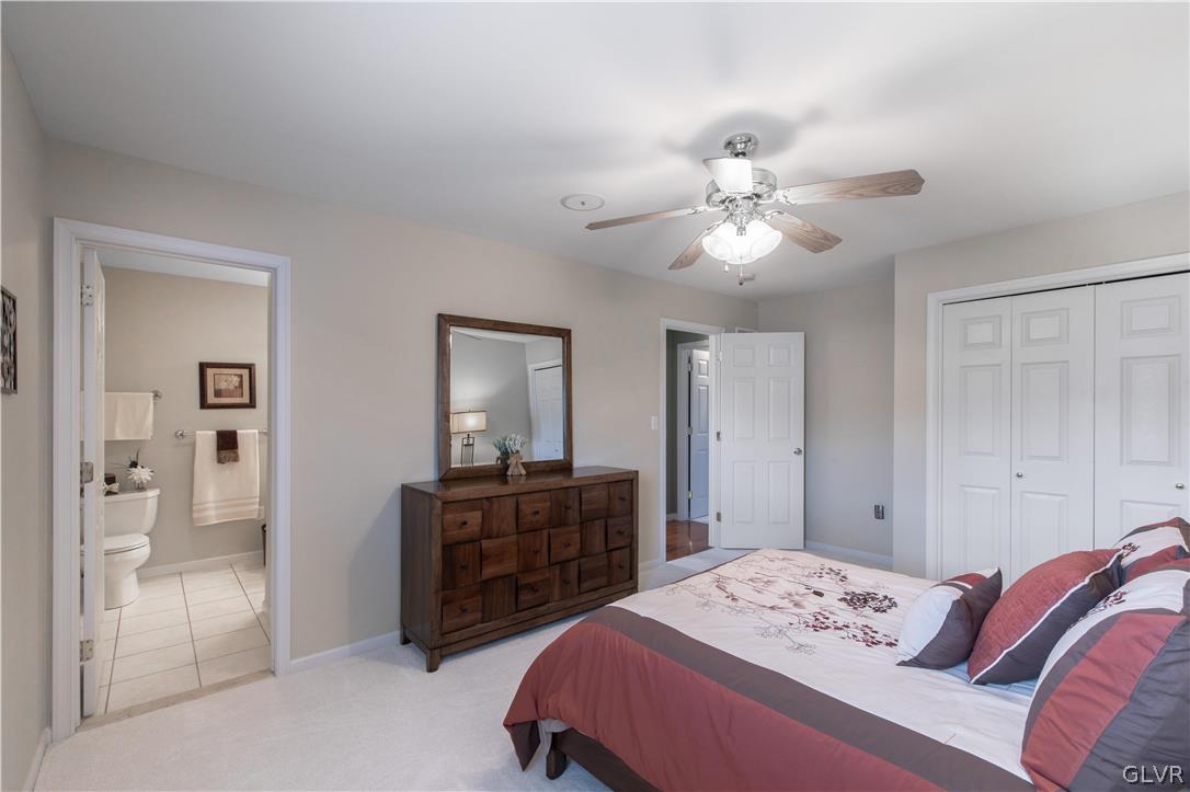 4142 Walter Road Bethlehem, PA 18020 - Photo 42 of 50 a bedroom with a bed and a chandelier