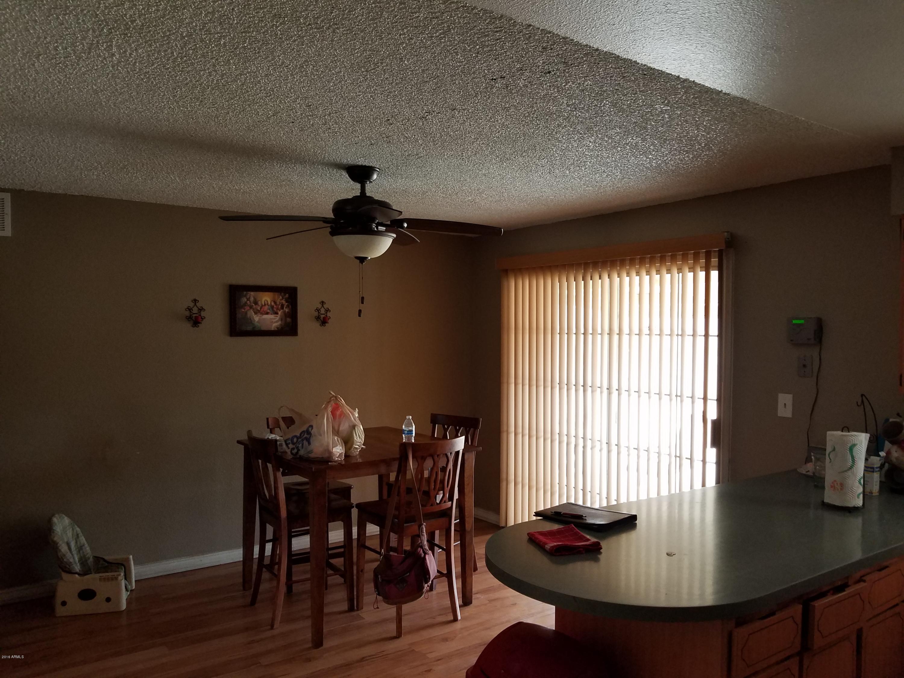4939 West Berkeley Road Phoenix, AZ 85035 - Photo 13 of 60 a view of a dining room with furniture and window