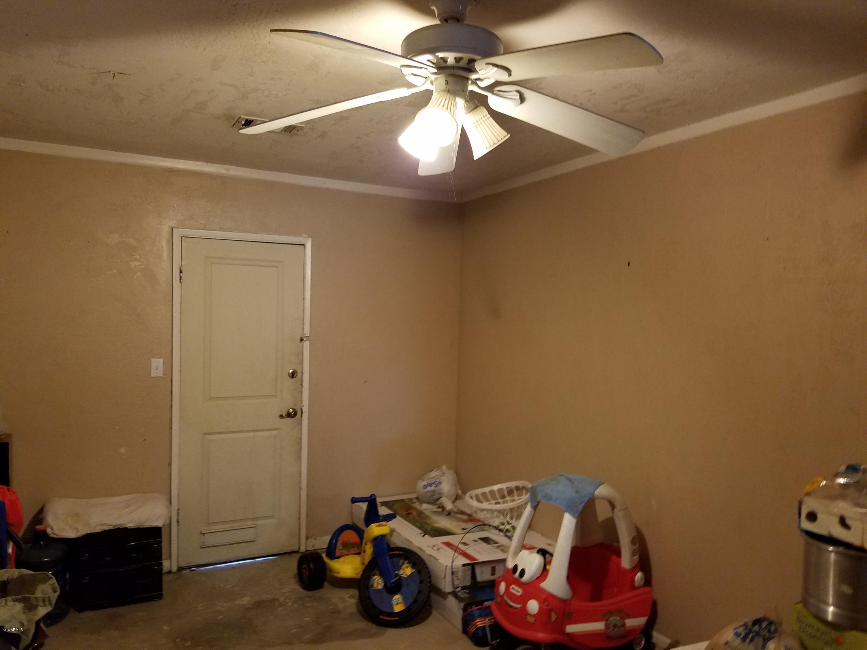 4939 West Berkeley Road Phoenix, AZ 85035 - Photo 15 of 60 a view of a room with gym equipment