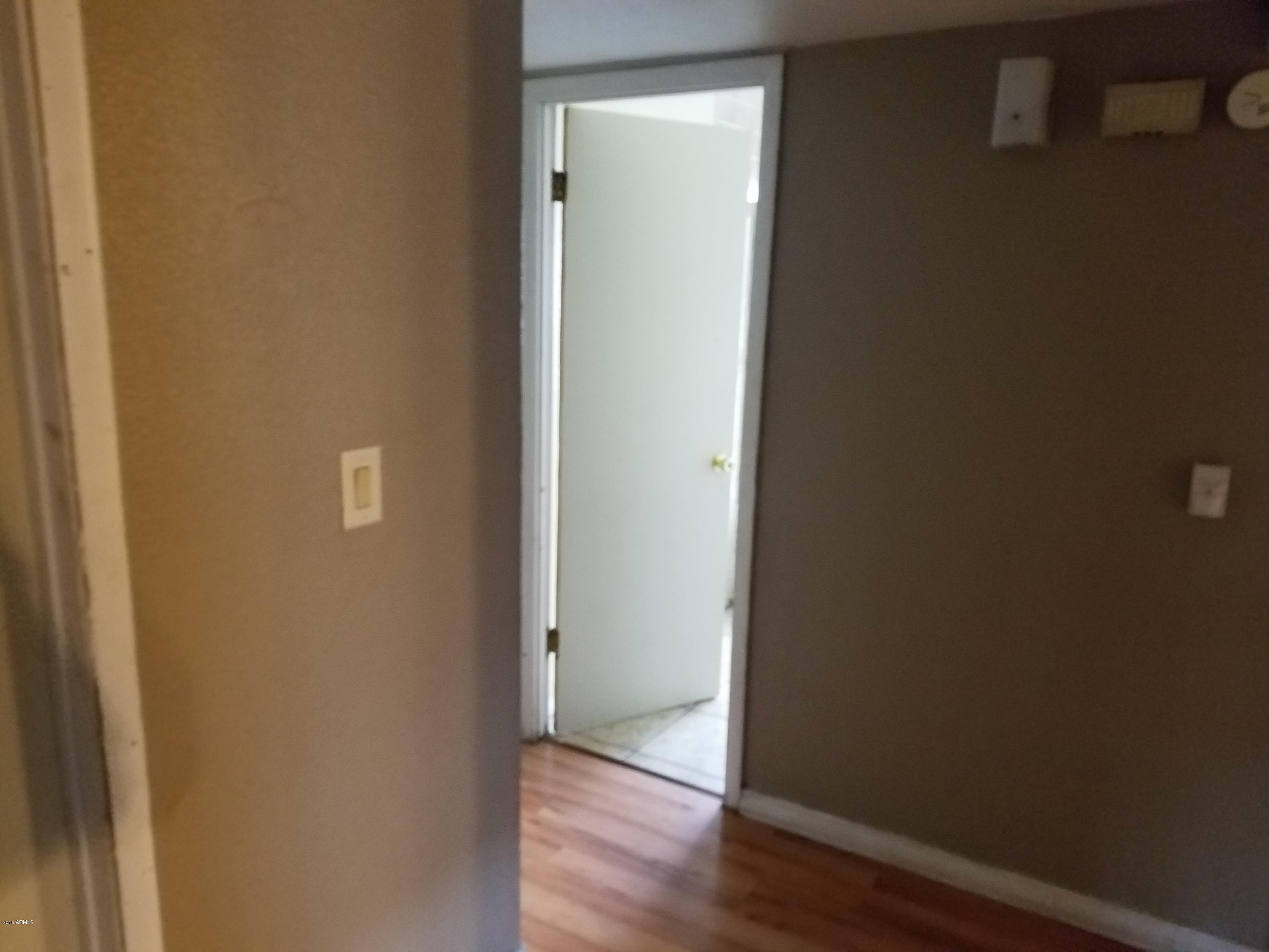 4939 West Berkeley Road Phoenix, AZ 85035 - Photo 23 of 60 a view of front door with wooden floor