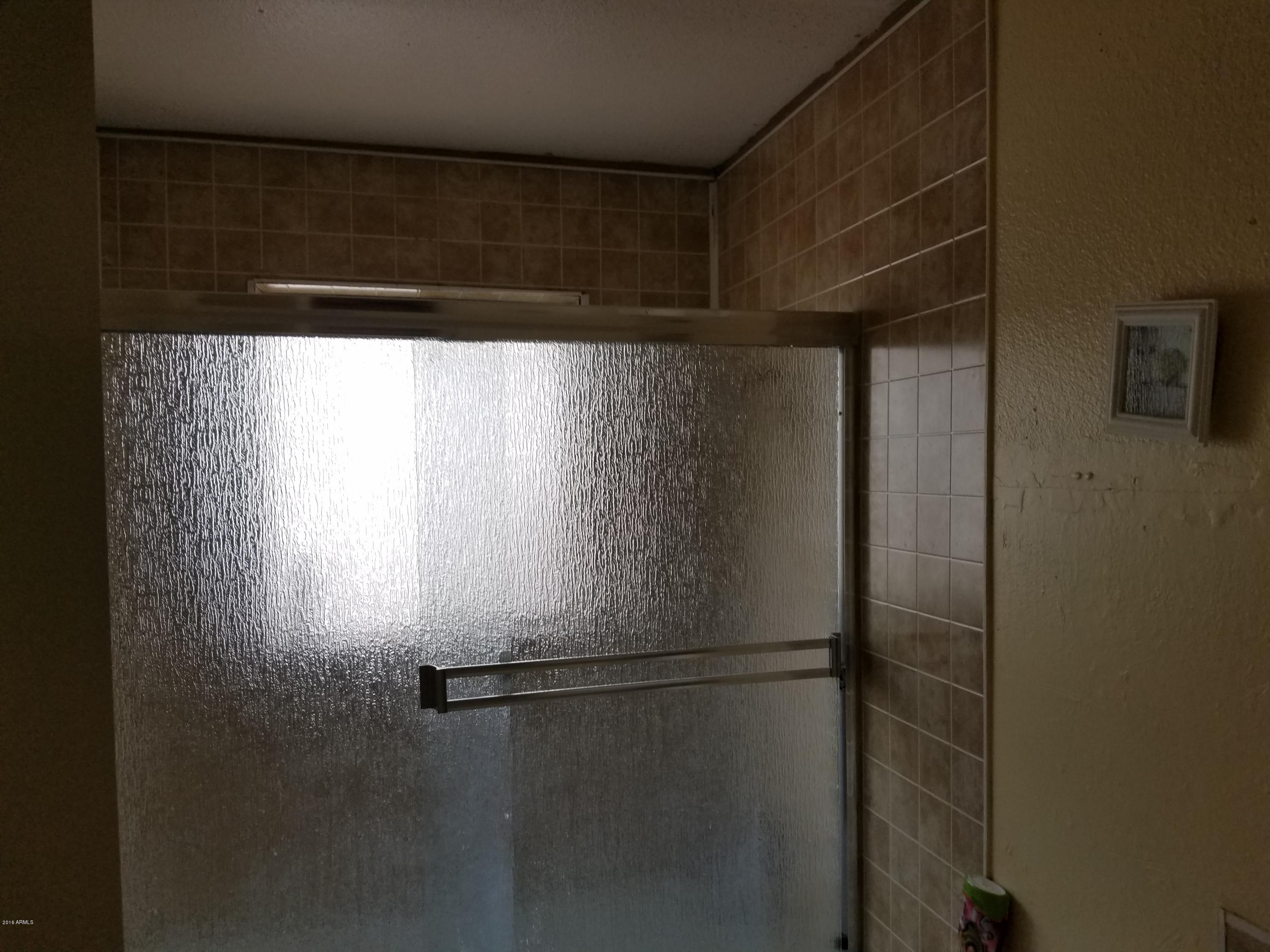4939 West Berkeley Road Phoenix, AZ 85035 - Photo 28 of 60 a close view of shower tap