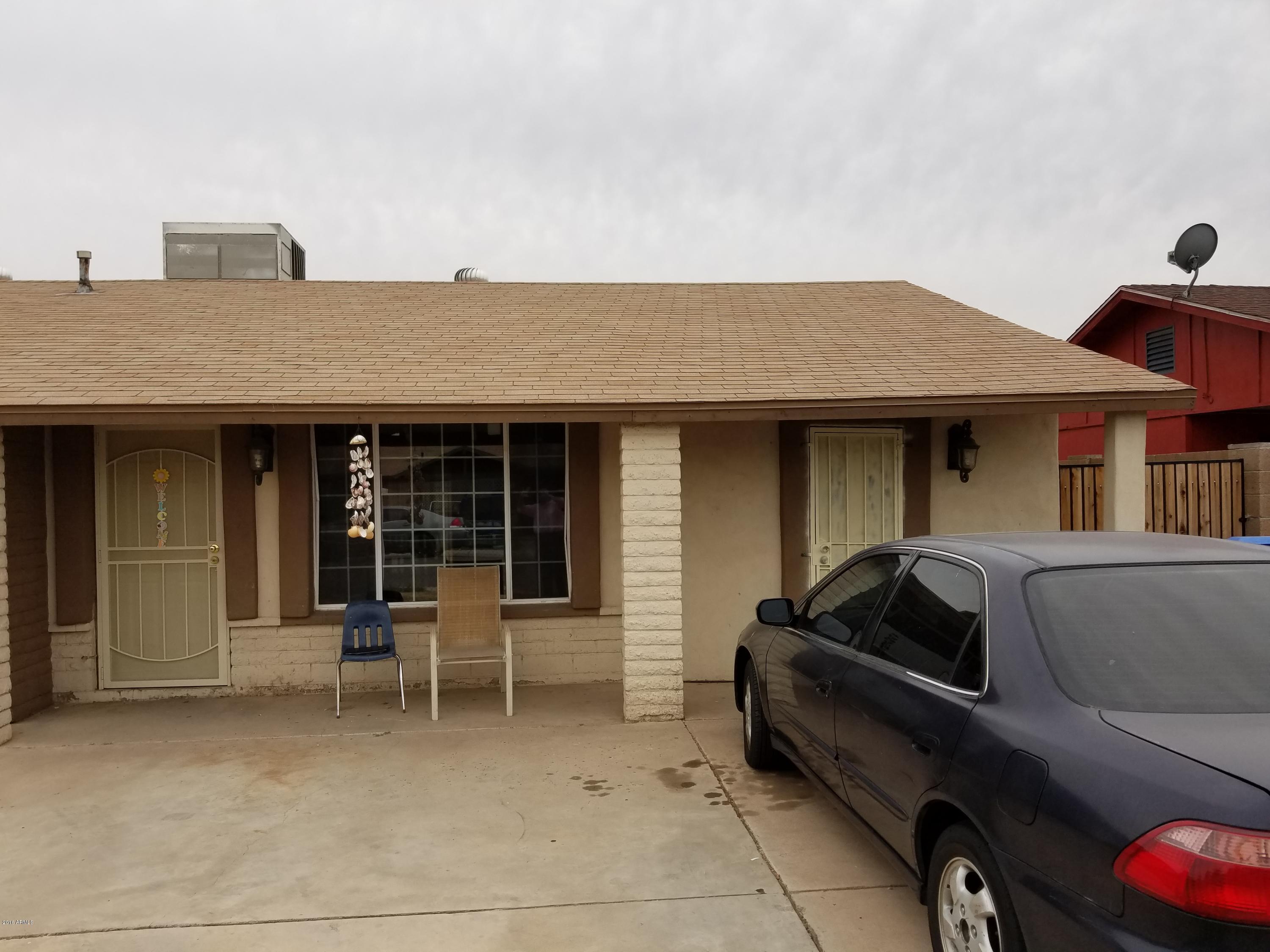 4939 West Berkeley Road Phoenix, AZ 85035 - Photo 42 of 60 a front view of a house with outdoor seating