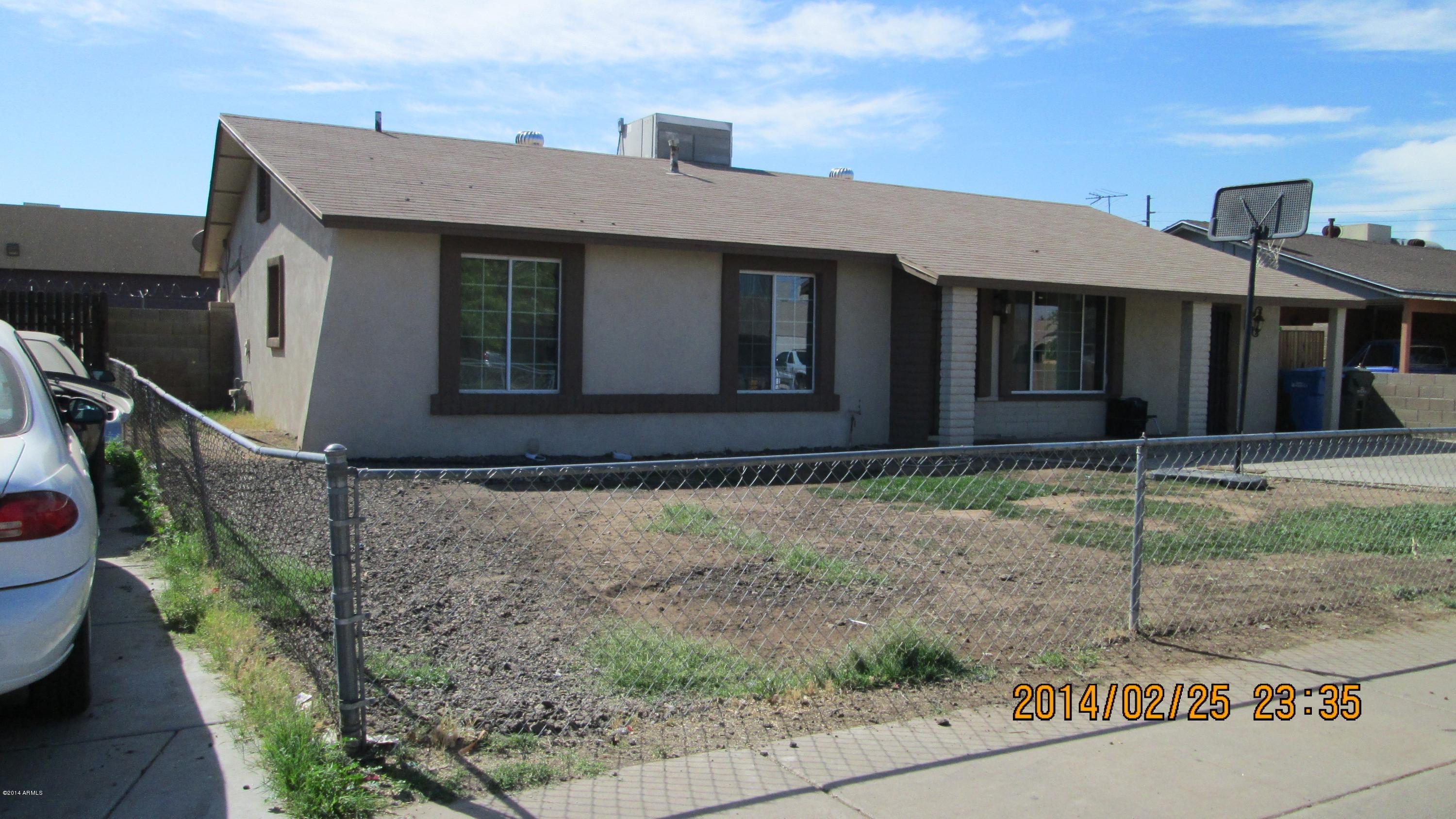 4939 West Berkeley Road Phoenix, AZ 85035 - Photo 5 of 60 a front view of a house with garden
