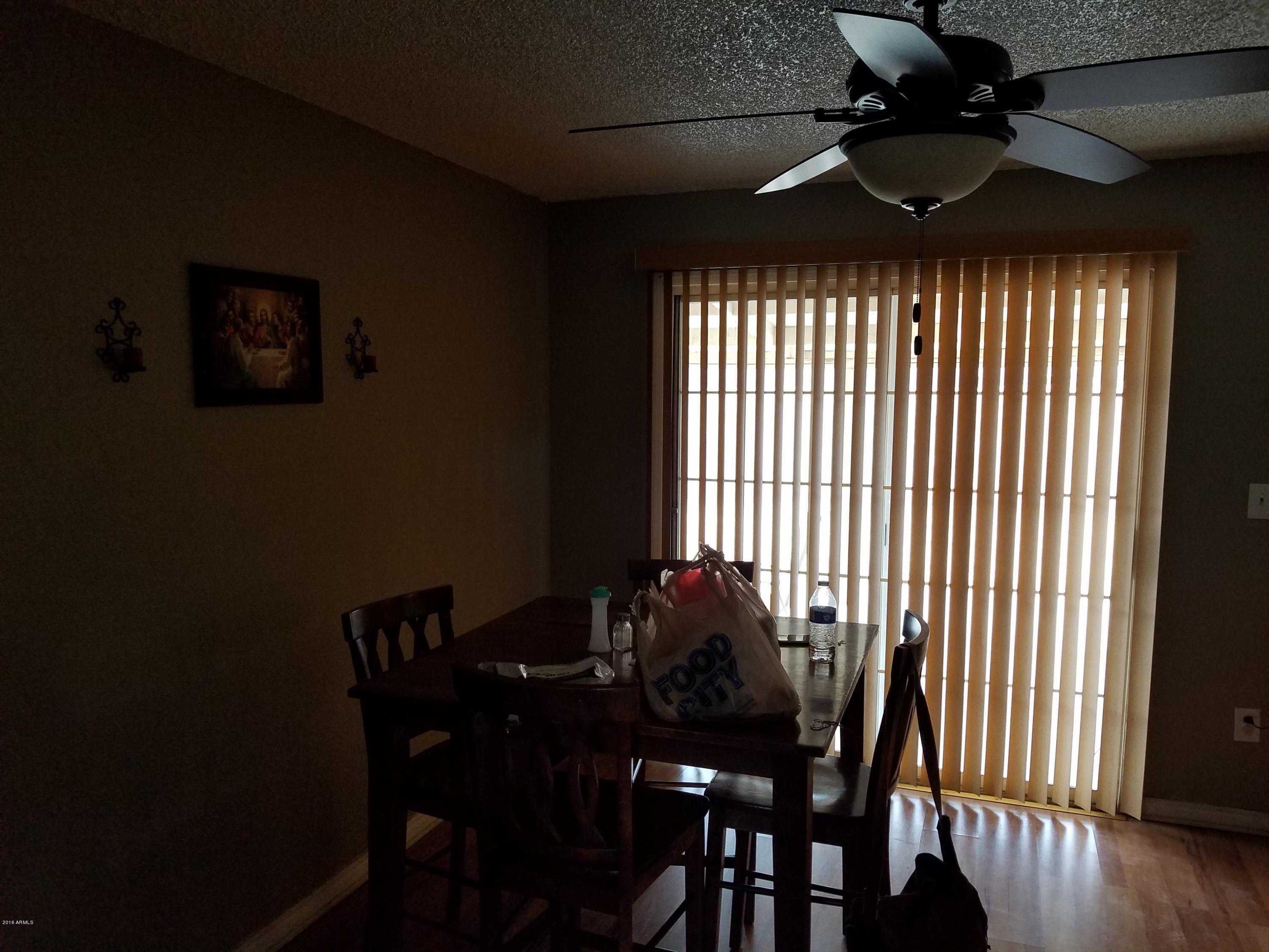 4939 West Berkeley Road Phoenix, AZ 85035 - Photo 55 of 60 a view of a dining room with furniture window and wooden floor