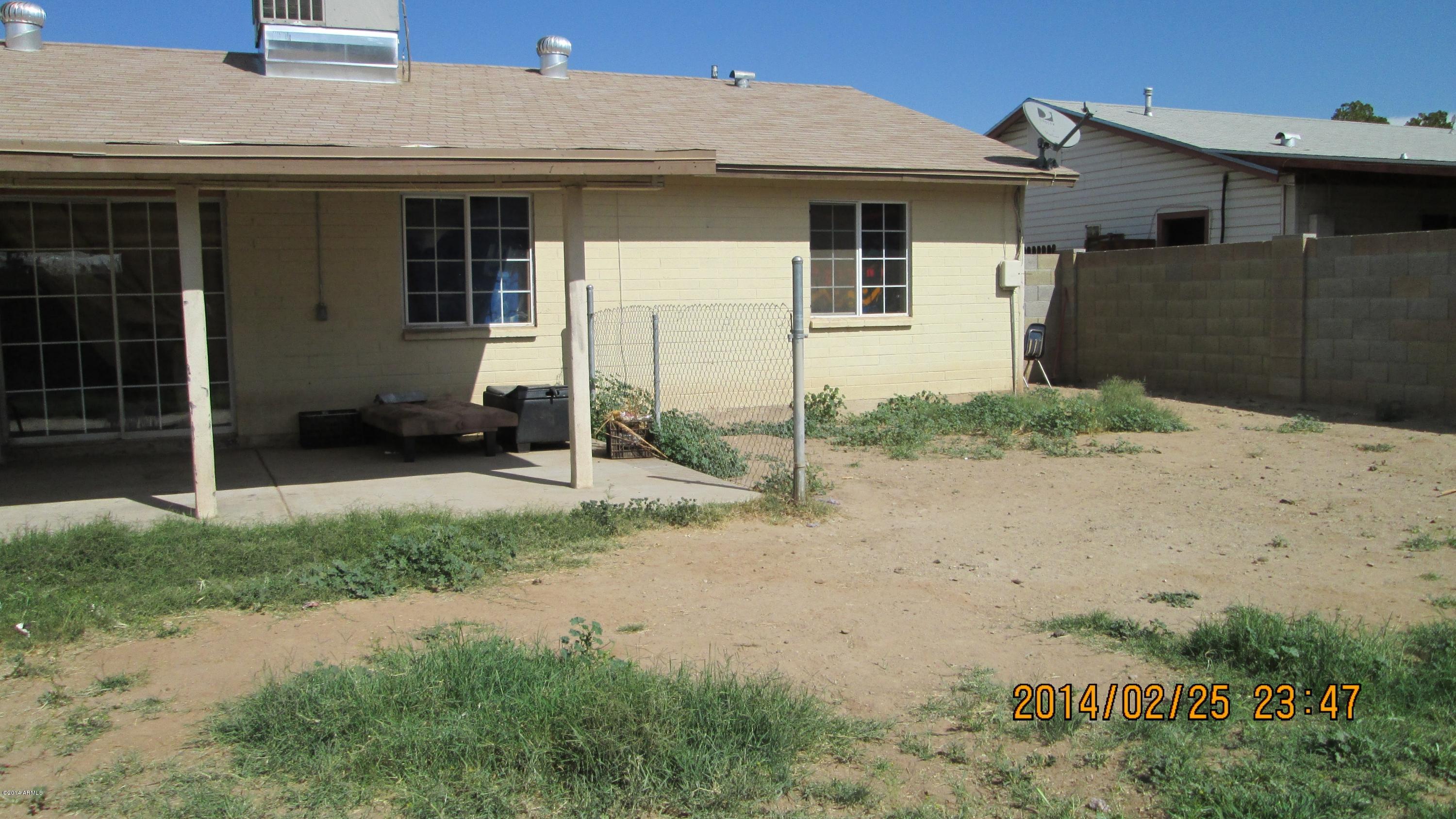 4939 West Berkeley Road Phoenix, AZ 85035 - Photo 59 of 60 a view of a house with a yard