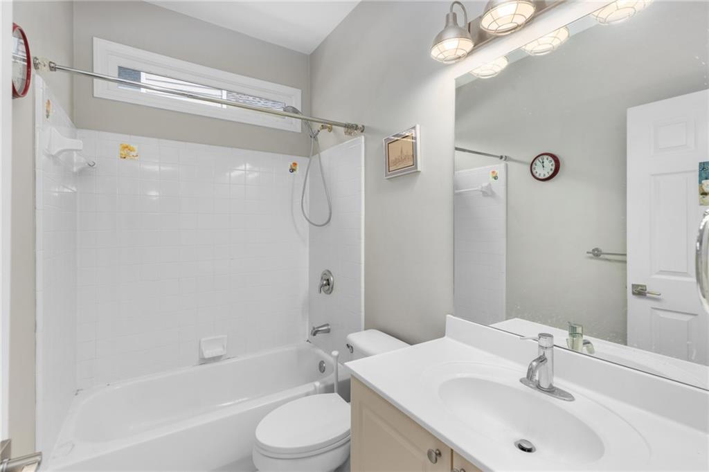 2631 East Madison Drive Atlanta, GA 30360 - Photo 12 of 66 a bathroom with a sink a toilet and shower