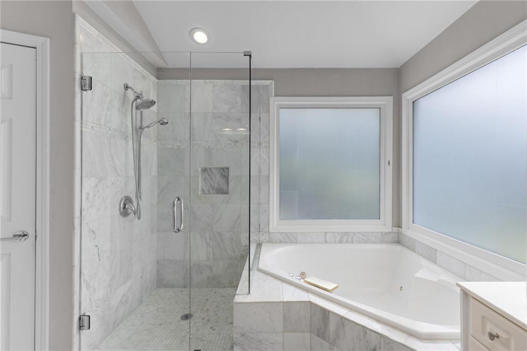2631 East Madison Drive Atlanta, GA 30360 - Photo 41 of 66 a bathroom with a shower a bathtub and a shower