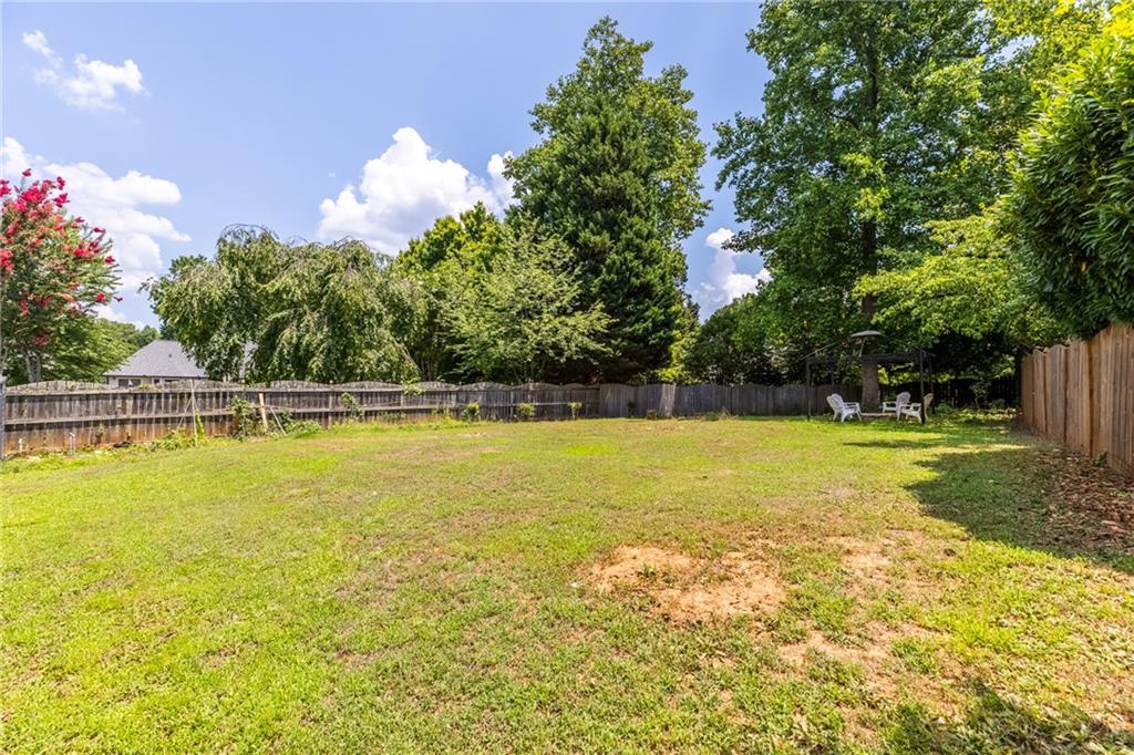 2631 East Madison Drive Atlanta, GA 30360 - Photo 59 of 66 a view of a swimming pool with an outdoor space and seating area