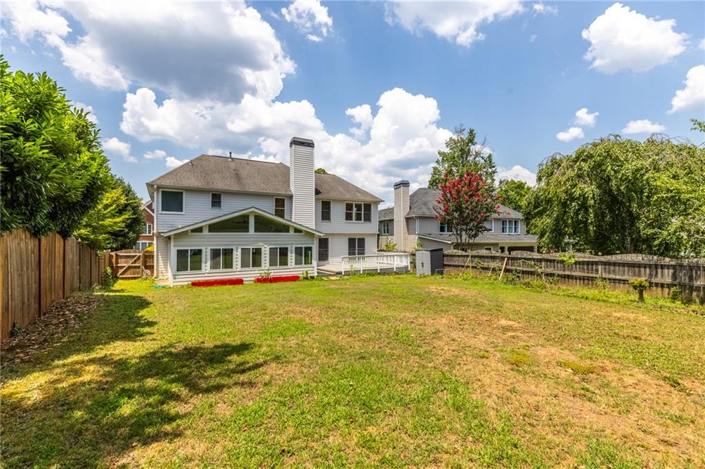 2631 East Madison Drive Atlanta, GA 30360 - Photo 61 of 66 a view of a swimming pool with a lawn chairs and plants