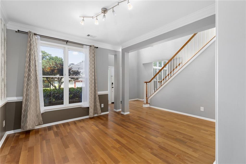 2631 East Madison Drive Atlanta, GA 30360 - Photo 8 of 66 a view of empty room with wooden floor and fan