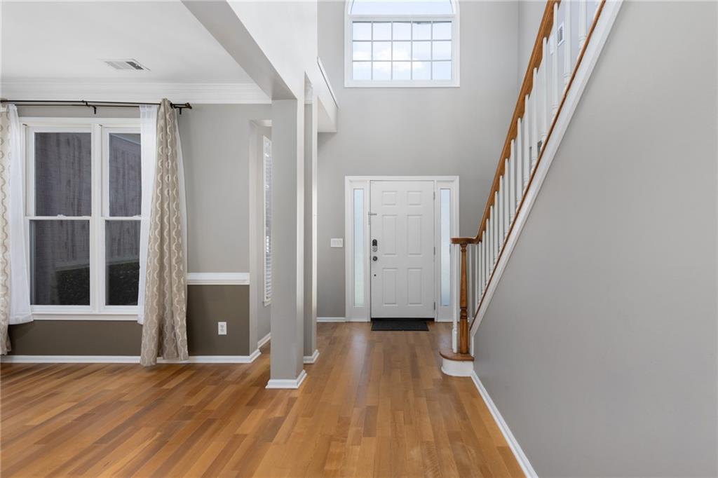 2631 East Madison Drive Atlanta, GA 30360 - Photo 9 of 66 wooden floor in an empty room with a window