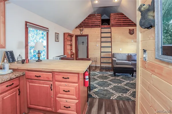 a kitchen with a stove and a refrigerator