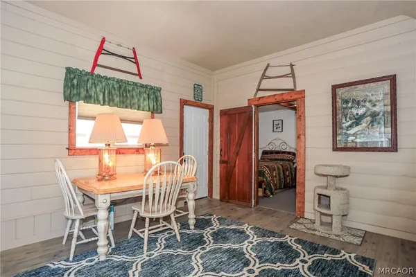 a dining room with furniture and window