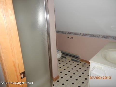 2709 Radcliff Road Bushkill, PA 18324 - Photo 8 of 10 a bathroom with a sink and a mirror