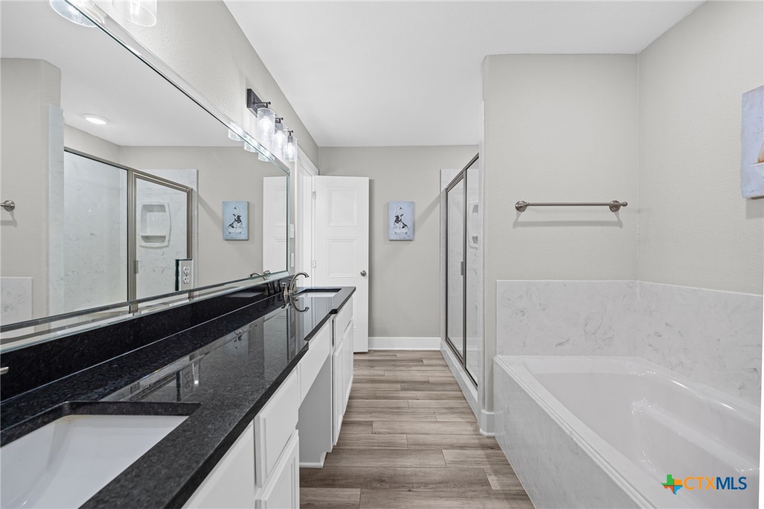28099 Fm 2670 Killeen, TX 76549 - Photo 24 of 48 a bathroom with a bathtub and a sink