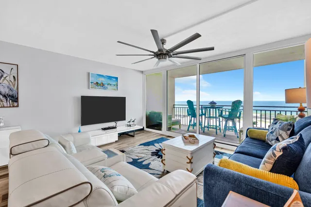 a work room with furniture and a large window