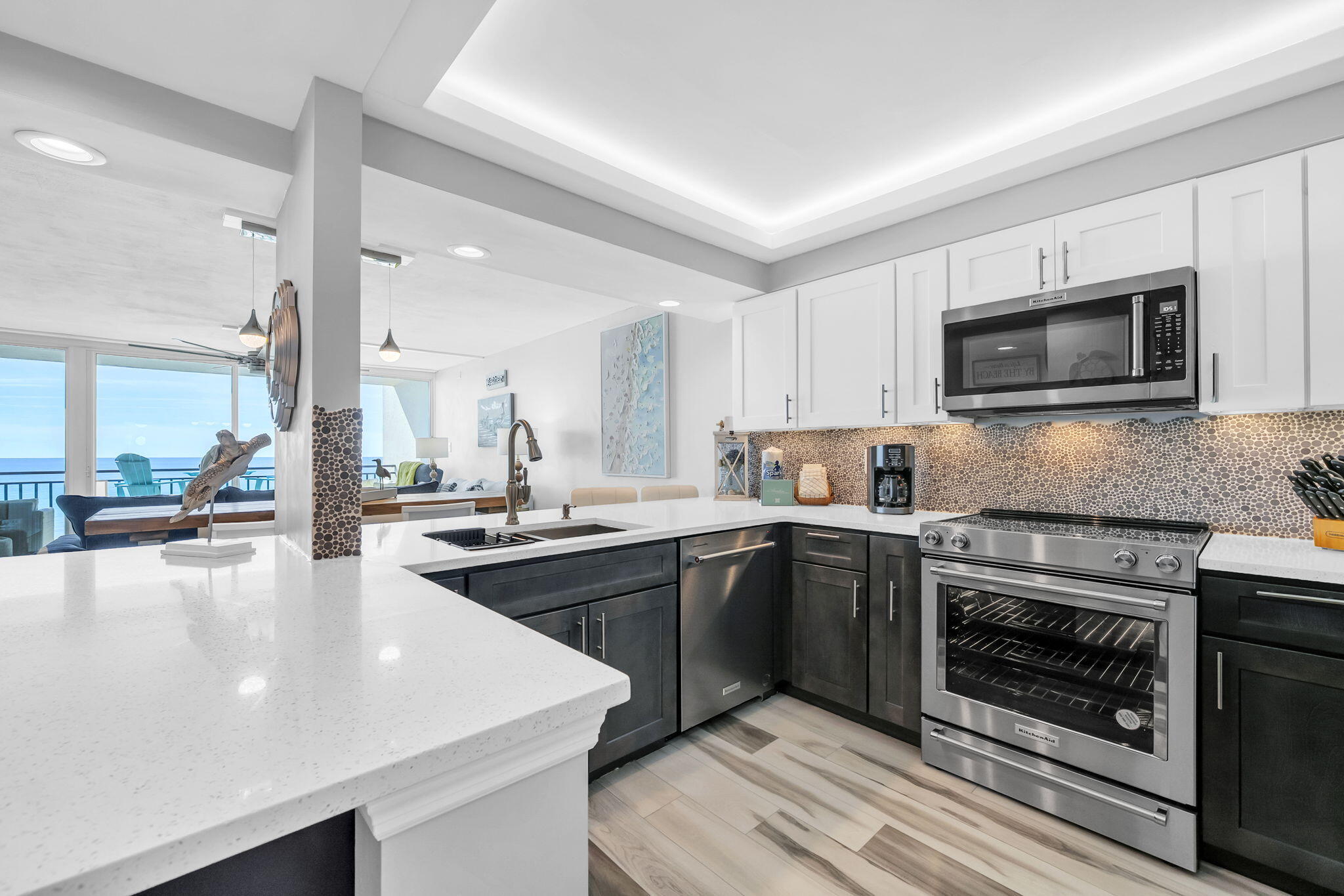 381 Santa Rosa Boulevard, Unit W515 Fort Walton Beach, FL 32548 - Photo 1 of 30 a kitchen with stainless steel appliances granite countertop a stove top oven a sink and a microwave