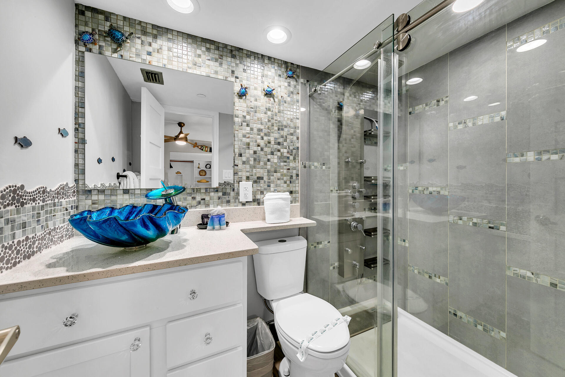 381 Santa Rosa Boulevard, Unit W515 Fort Walton Beach, FL 32548 - Photo 13 of 30 a bathroom with a sink a toilet and shower