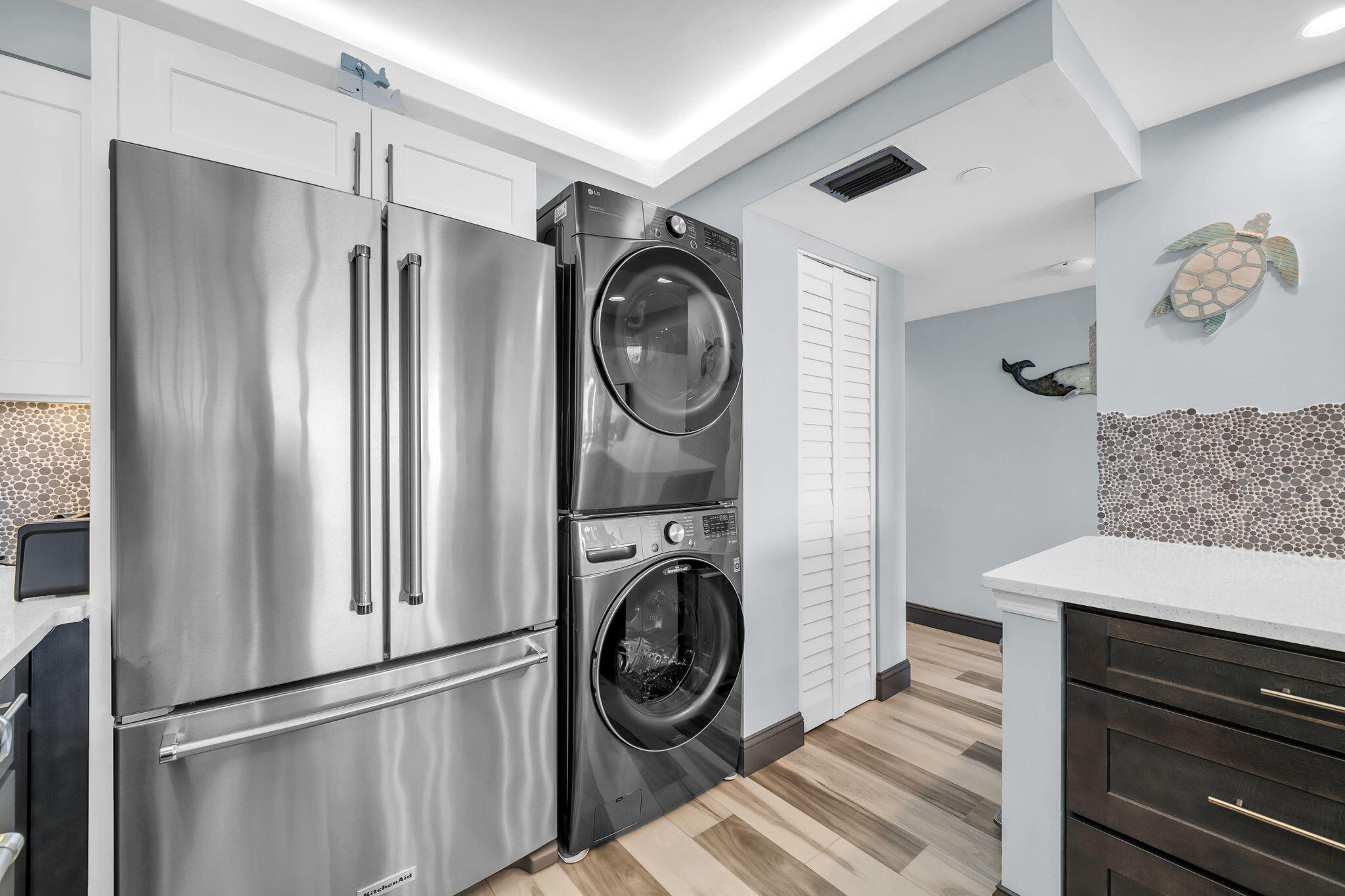 381 Santa Rosa Boulevard, Unit W515 Fort Walton Beach, FL 32548 - Photo 15 of 30 a view of a storage and utility room with washer and dryer