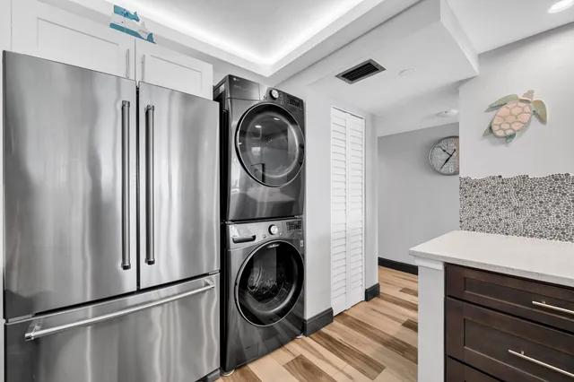 a view of a storage and utility room with washer and dryer