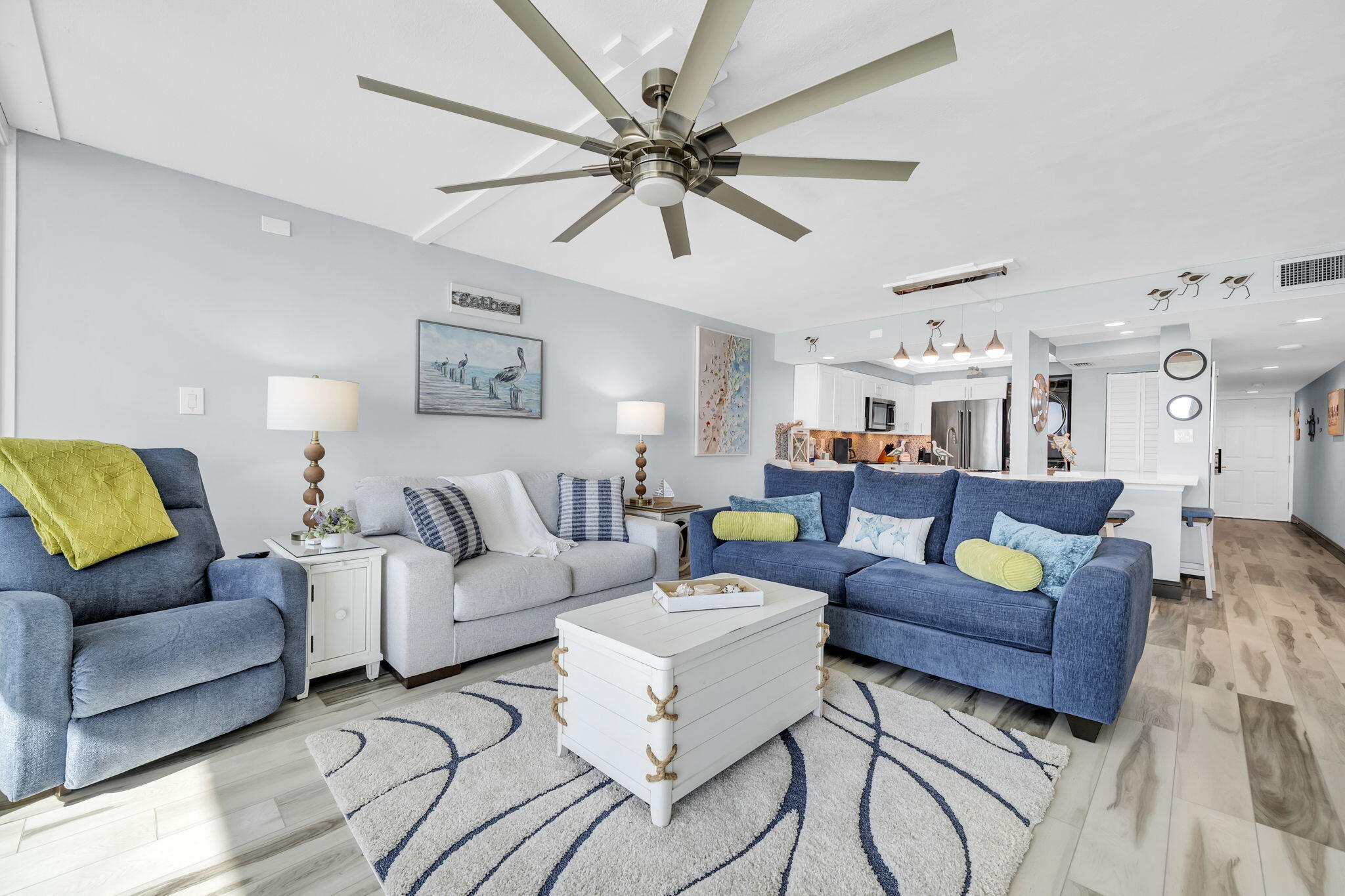 381 Santa Rosa Boulevard, Unit W515 Fort Walton Beach, FL 32548 - Photo 2 of 30 a living room with furniture and a chandelier