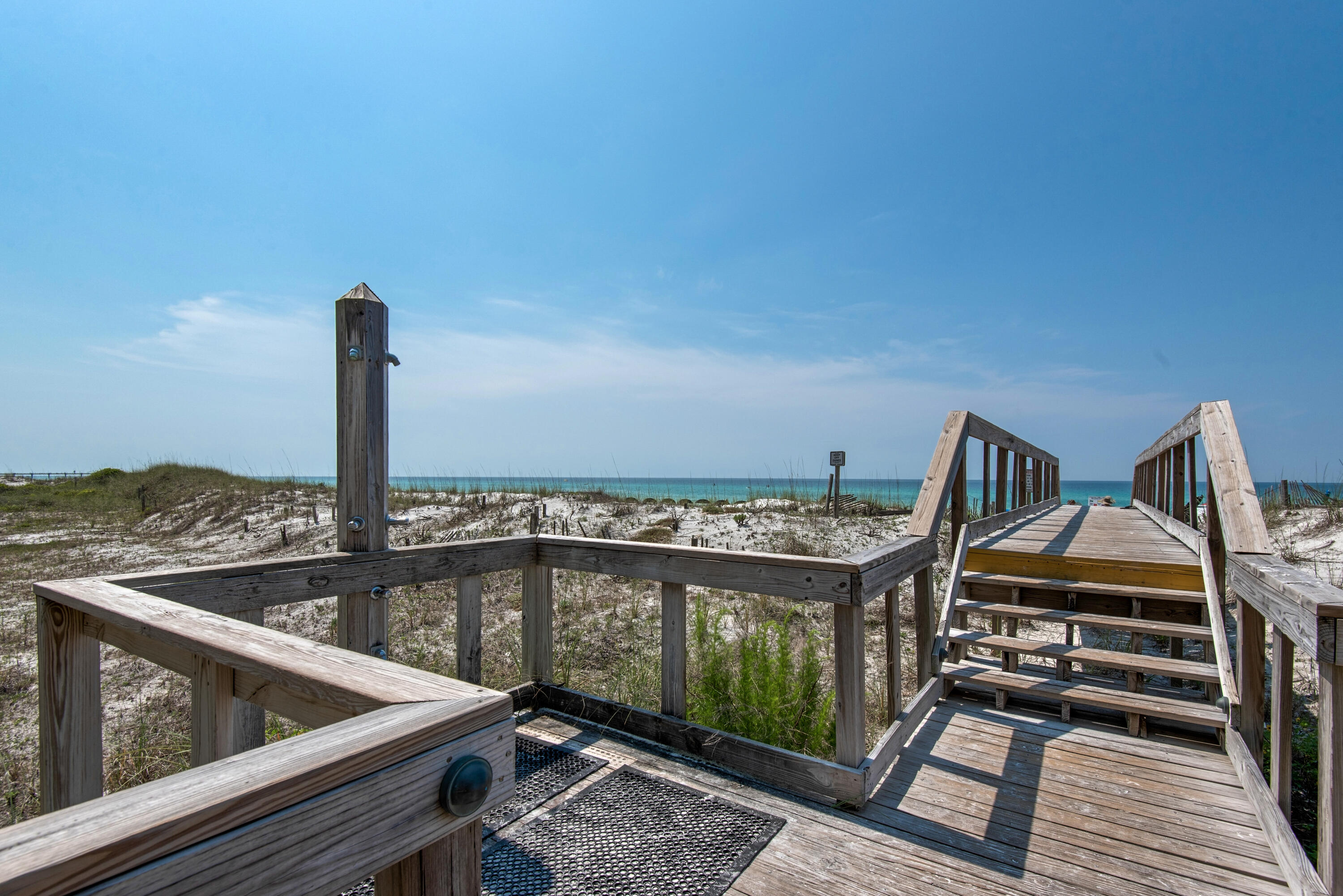 381 Santa Rosa Boulevard, Unit W515 Fort Walton Beach, FL 32548 - Photo 28 of 30 a view of a balcony with two chairs and wooden floor