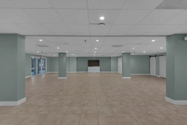 a view of a livingroom with a kitchen