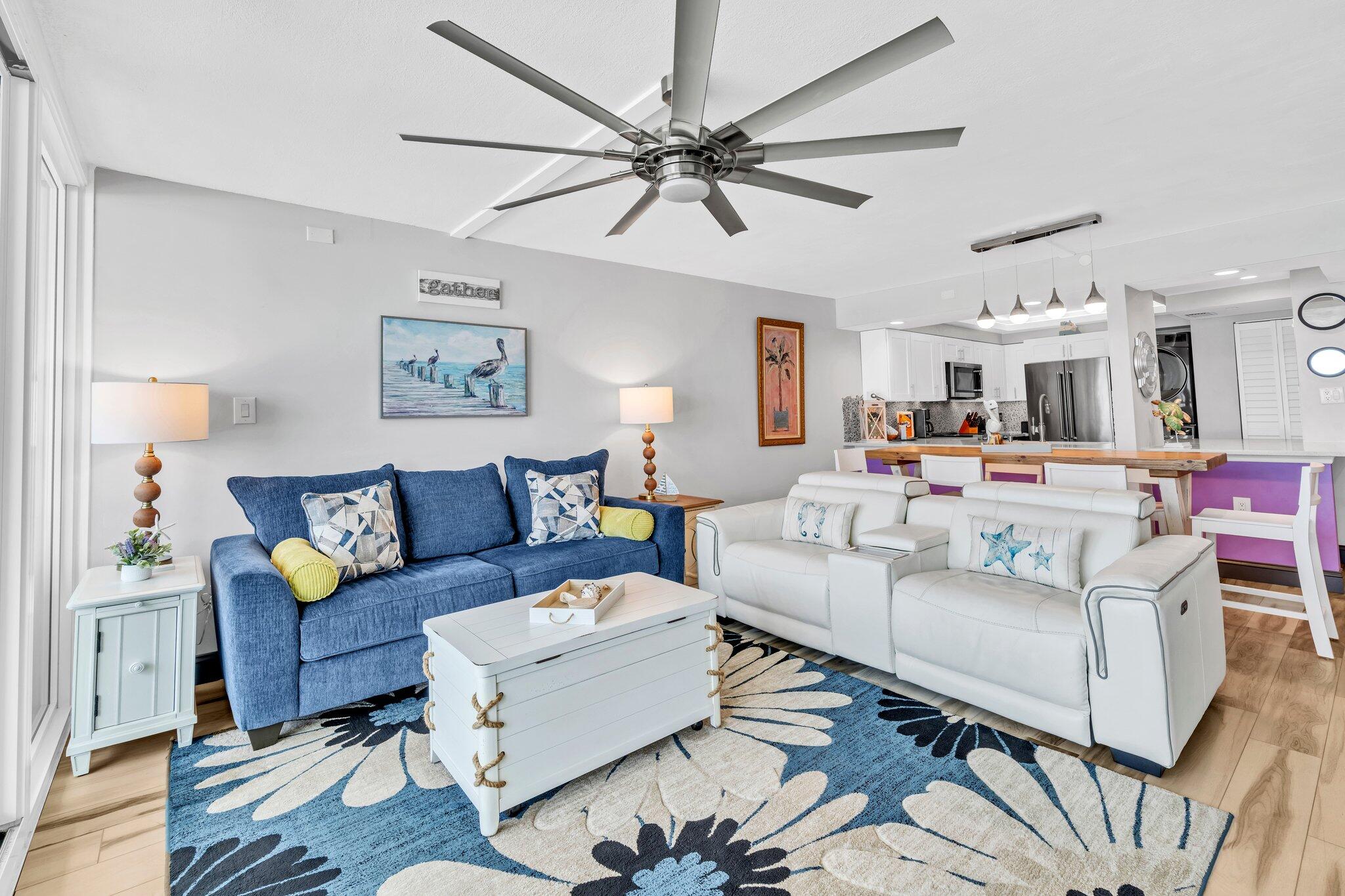 381 Santa Rosa Boulevard, Unit W515 Fort Walton Beach, FL 32548 - Photo 3 of 34 a living room with furniture and a chandelier