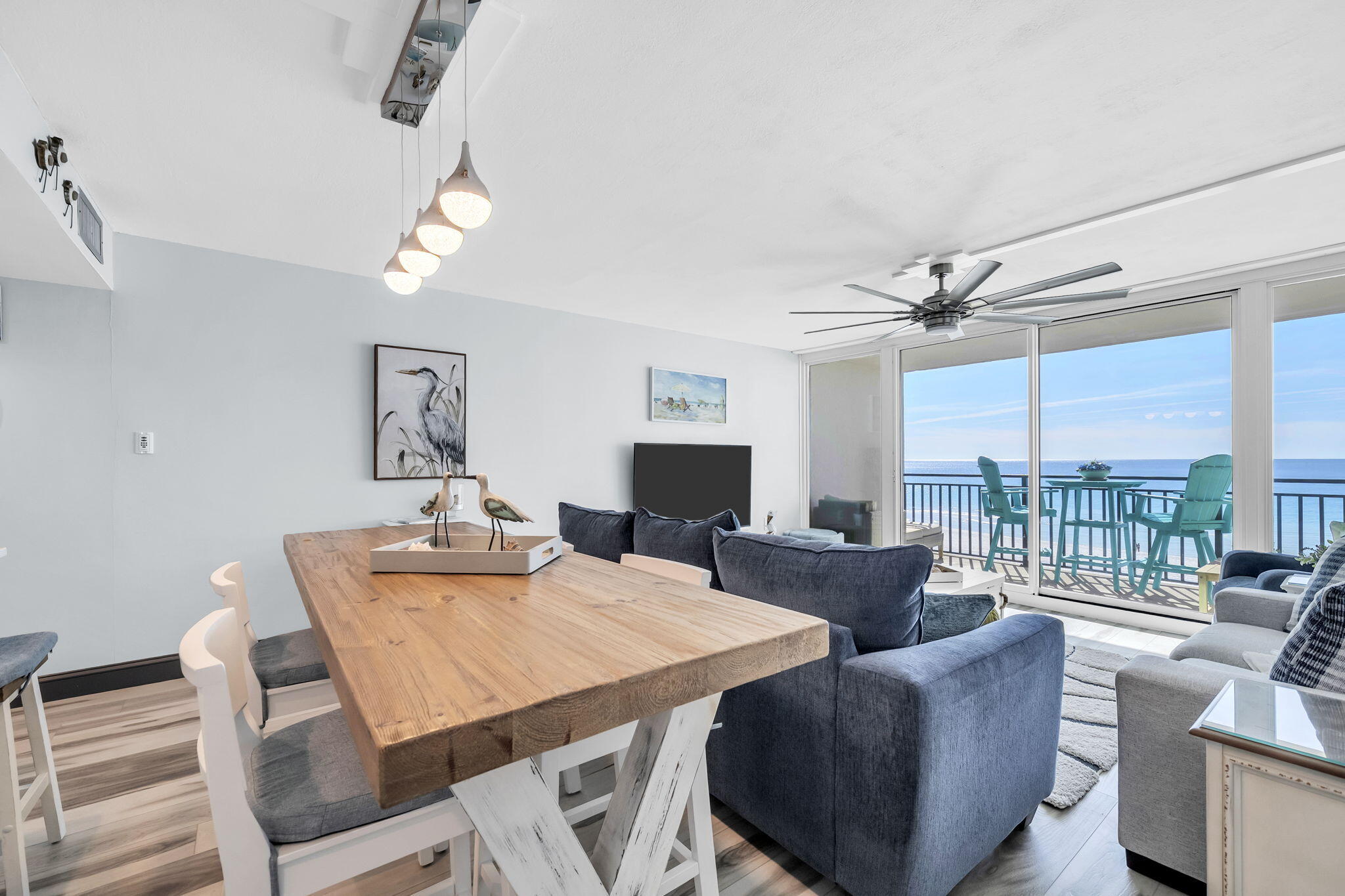 381 Santa Rosa Boulevard, Unit W515 Fort Walton Beach, FL 32548 - Photo 4 of 30 a view of a dining room with furniture a chandelier and a large window