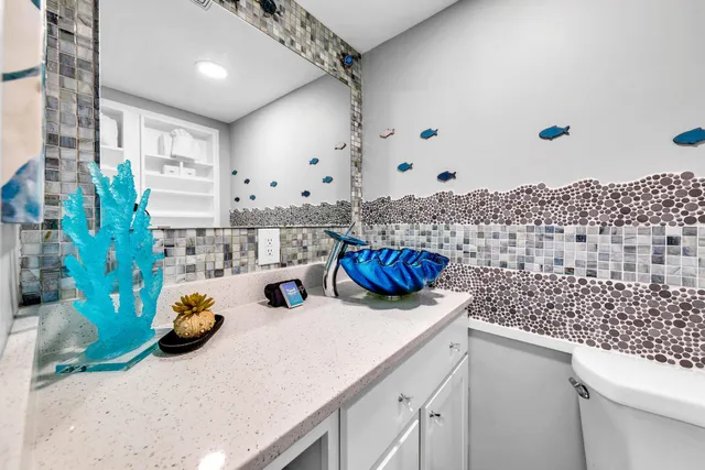 a bathroom with a sink a mirror and shower