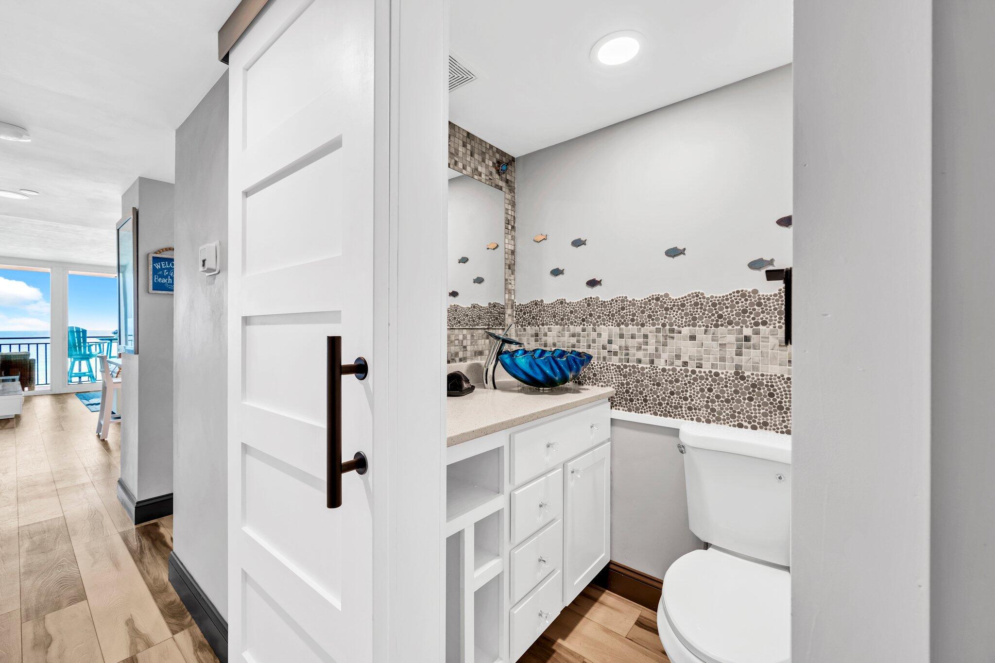 381 Santa Rosa Boulevard, Unit W515 Fort Walton Beach, FL 32548 - Photo 9 of 34 a bathroom with a sink a toilet and shower