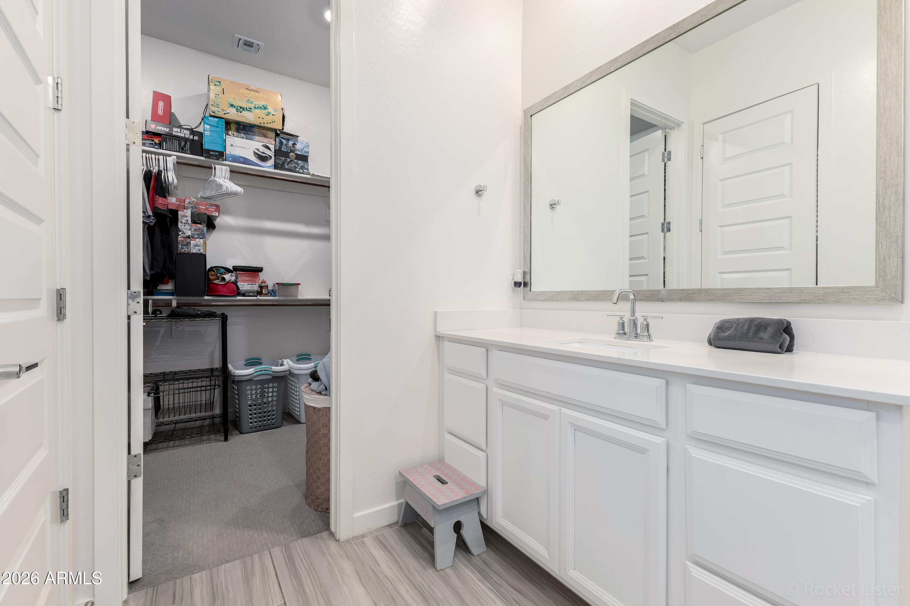 23929 North 166th Lane Surprise, AZ 85387 - Photo 12 of 23 a bathroom with a sink a toilet and a mirror