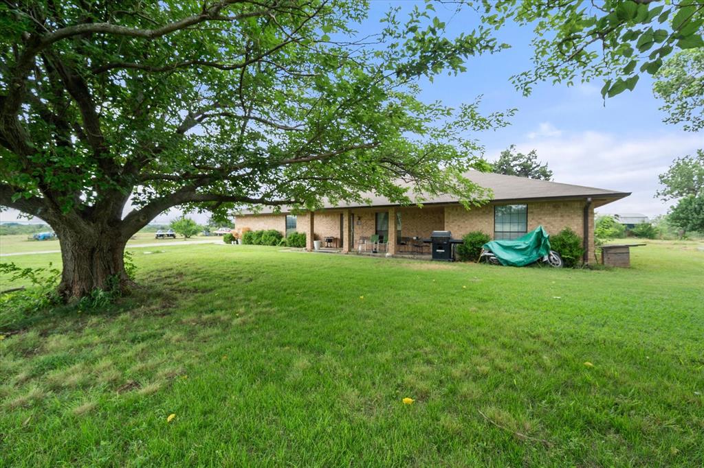 3748 Old Fort Worth Road Midlothian, TX 76065 - Photo 15 of 40 Mature trees and covered front porch make country life near the city still possible.